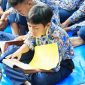 Salah satu siswa SMPN 5 Kota Serang saat sedang membaca Al-Quran, dalam acara Tasyakuran dan Tadarusan bersama Walikota Serang Budi Rustandi di lapangan sekolah tersebut I Dok. Roy-BNC